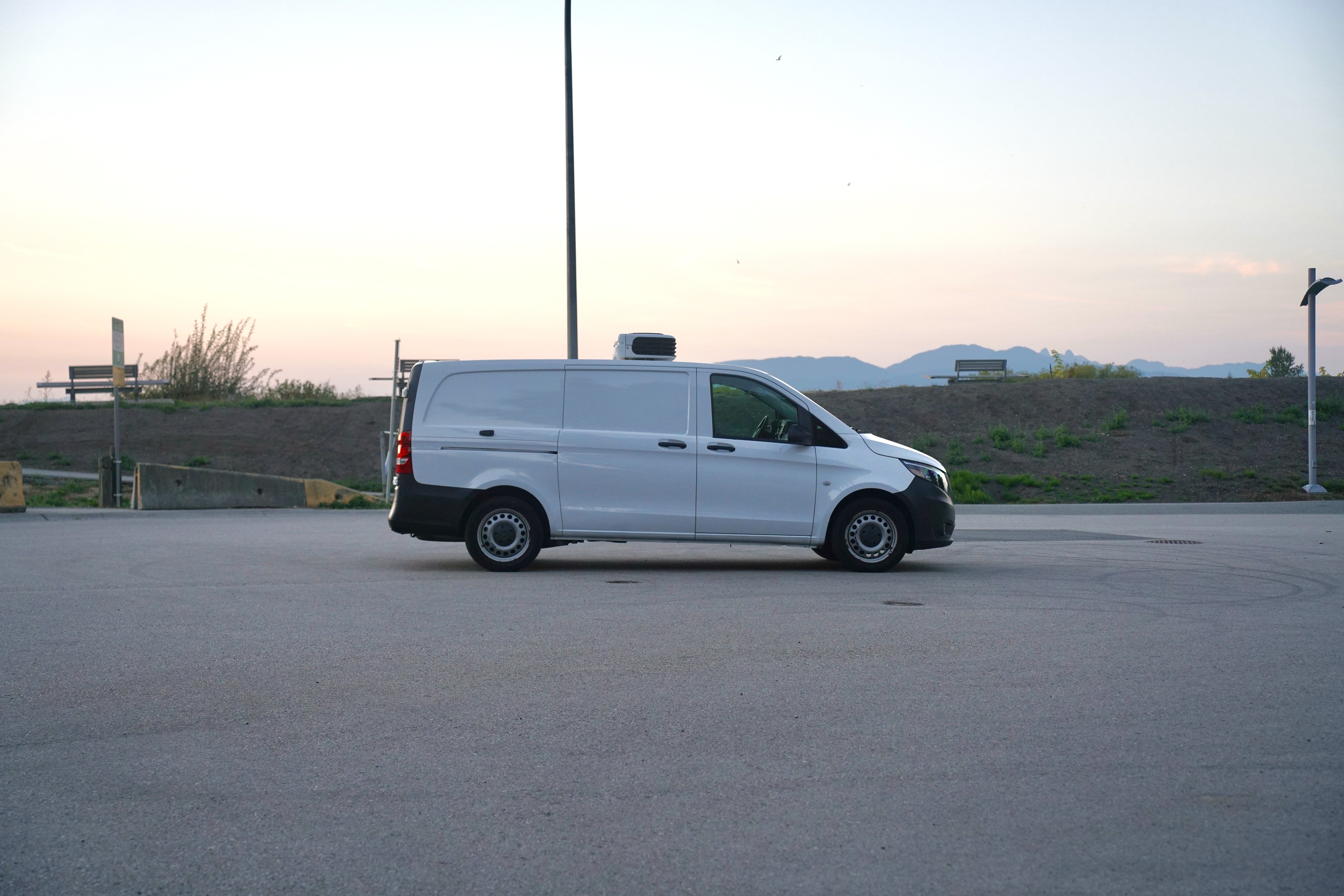 A growing fleet of delivery vehicles at a logistics hub.