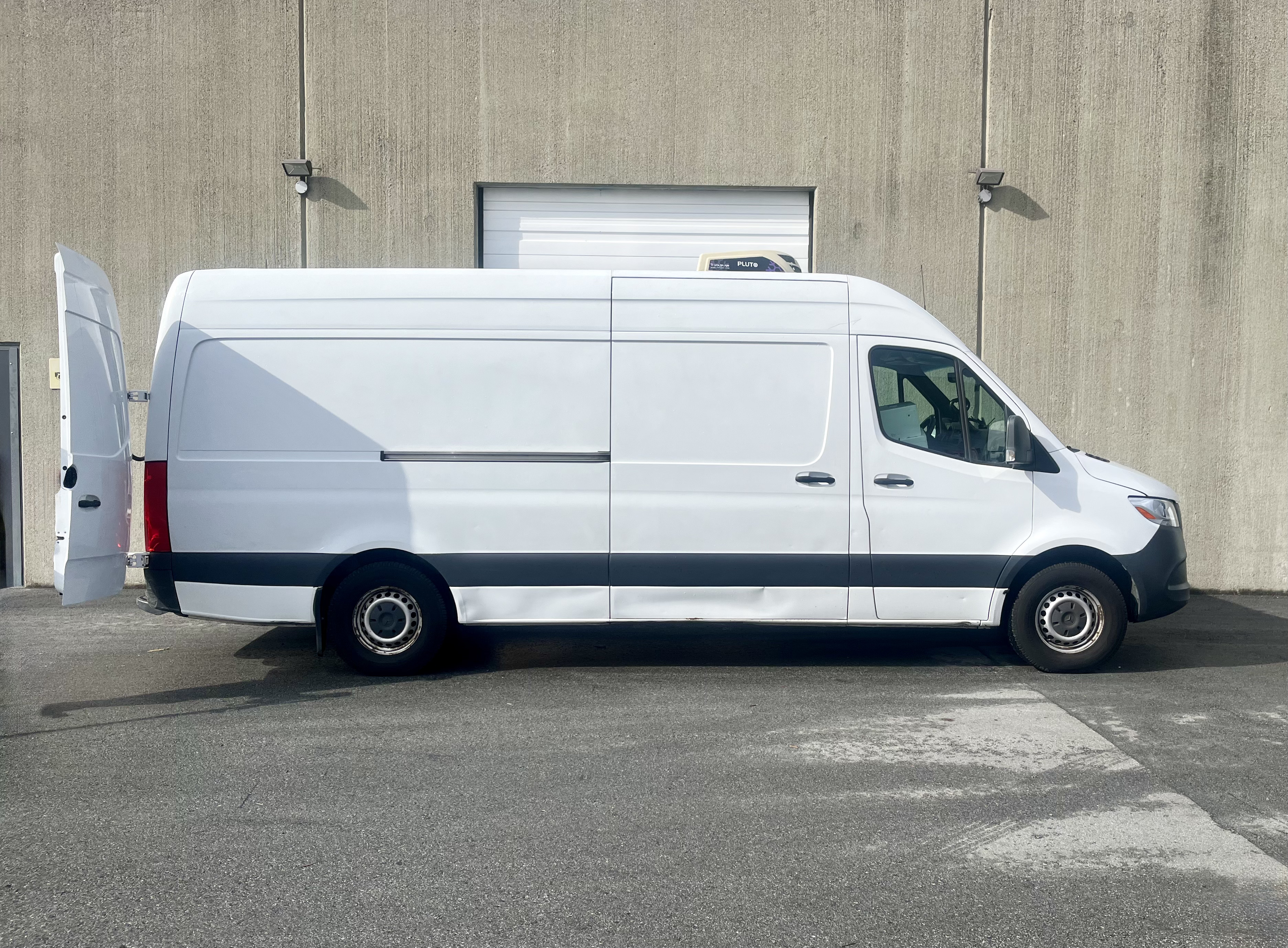 Professional delivery driver preparing a package for delivery.